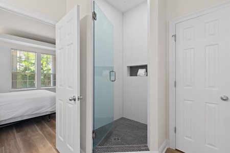 The ground floor master includes a king size bed and private bathroom with walk-in shower and tub!
