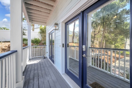 Step onto your private balcony and breathe in the fresh air. The covered deck offers a peaceful retreat with views of lush greenery and palm trees, perfect for morning coffee or evening relaxation.