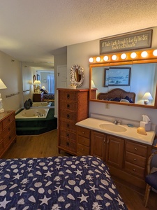 bedroom vanity and jacuzzi tub