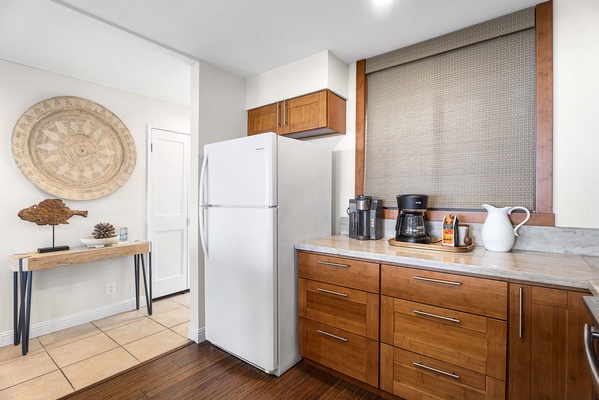 Coffee corner right beside the fridge.