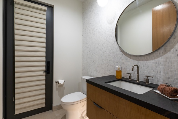 The ensuite bathroom with a single vanity.