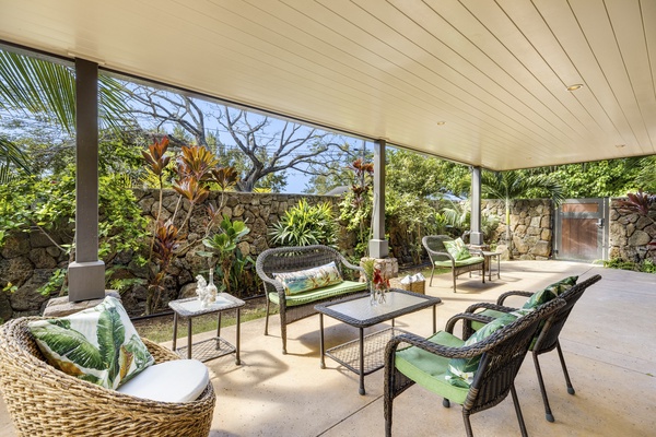 Downstairs patio lounge area and private gate to beach