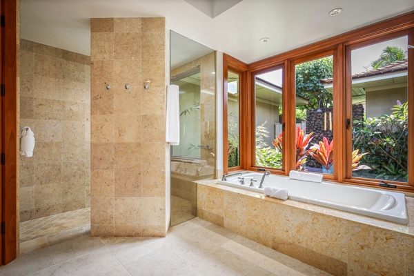 Primary suite shower and tub.