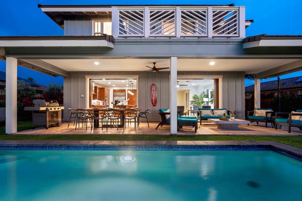 Poolside evening ambiance with open living areas.