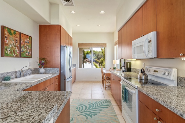 Ample counter space and cabinets in the fully equipped kitchen.