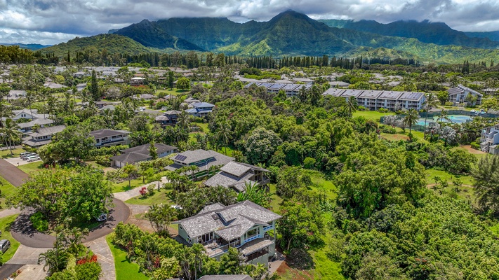 The distant mountains provide a majestic backdrop to the home.