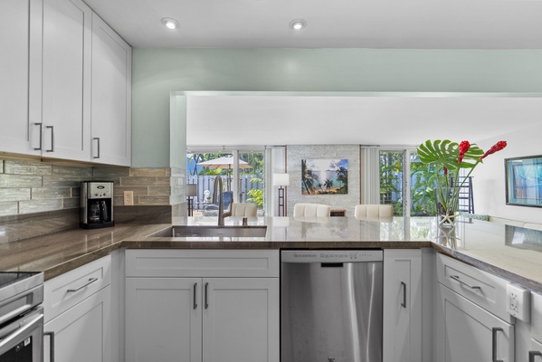 Expansive counter space awaits your culinary creativity in this well-appointed kitchen.