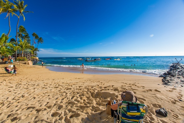 Relax on golden sands by clear blue waters.