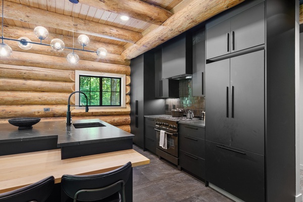 Gorgeous Scandinavian-inspired kitchen with ample storage cabinetry for a breezy meal prep.