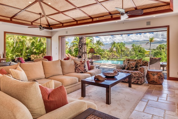 The bright and airy open living area features a plush sectional sofa.