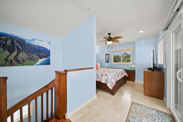 Going up the custom spiral staircase you come to the main bedroom loft