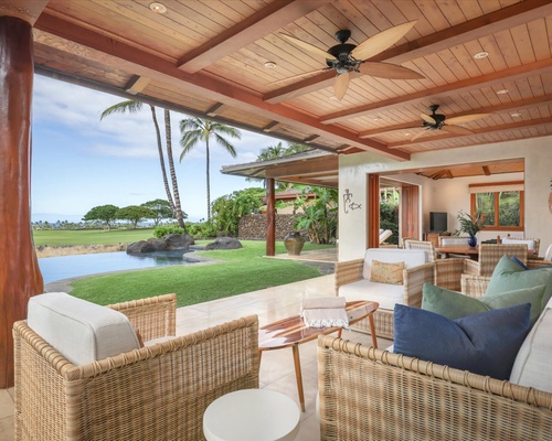 The spacious, covered lanai offers plush seating with horizon views