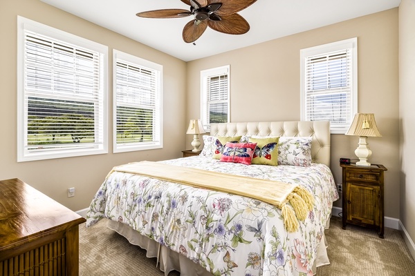 Upstairs guest bedroom equipped with King bed, A/C, and TV