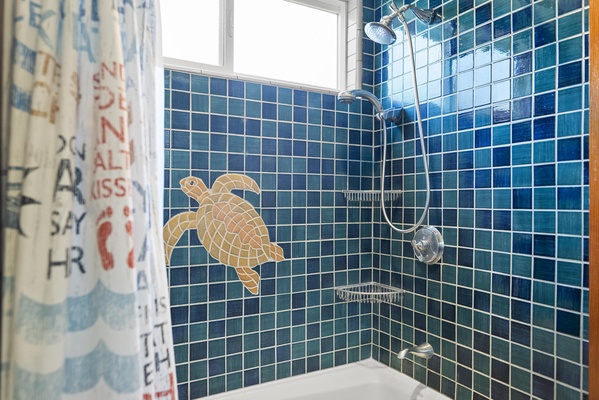 Shower/tub combo with oceanic tile details