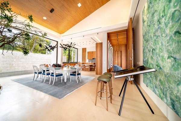 Beautifully lit dining space with seamless access to the kitchen.