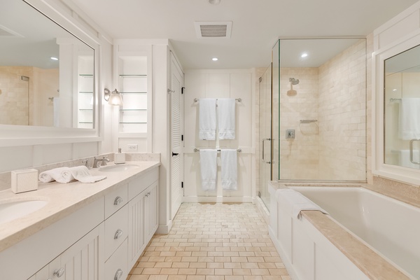 Venture into the primary bath for a mesmerizing soak in the large, relaxing tub, or enjoy the separate shower