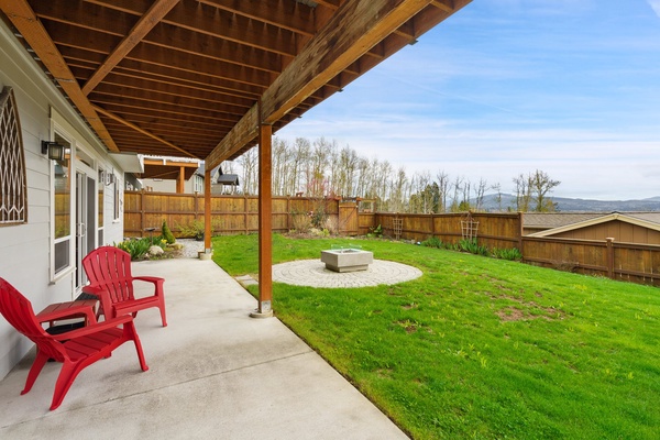 Embrace the cozy allure of the veranda, nestled by the fire pit