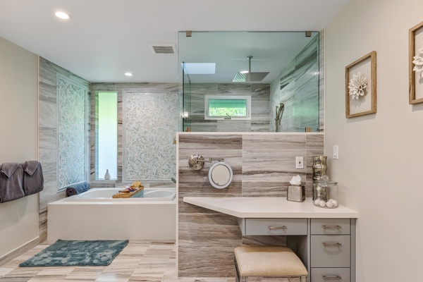 Indulgent private en suite bathroom featuring a soothing jetted tub