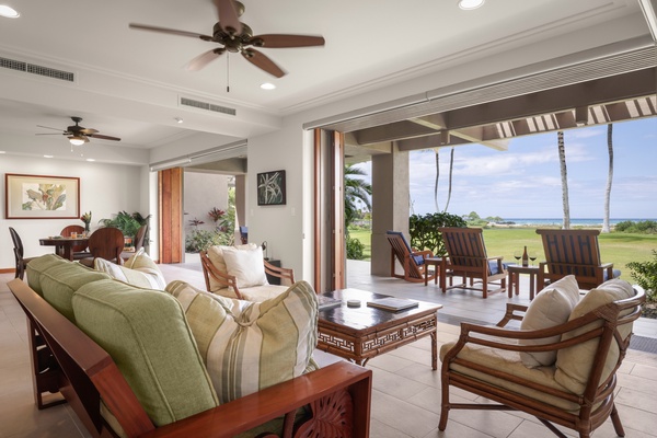 Multiple seating areas in great room with recessed ceilings and gorgeous natural light.