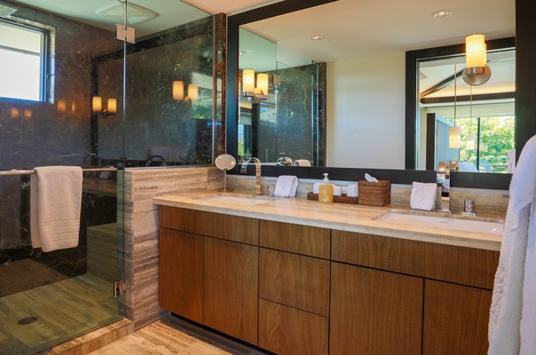 The en suite baths boast features like large walk-in showers and dual sinks