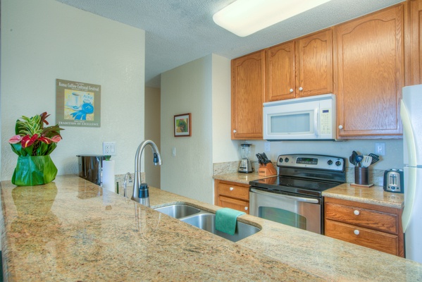 Kitchen has Granite Counters, Upgraded Cabinets, and Bar-seating.