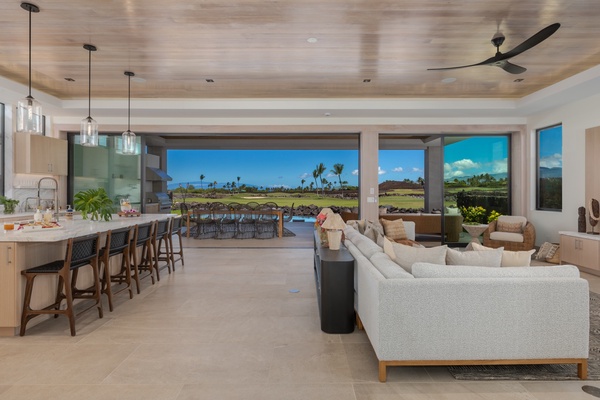 Seamlessly blending indoor comfort with stunning outdoor view of the lanai, this space is perfect for both relaxation and entertaining guests.