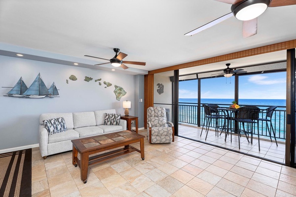 Seamless indoor-outdoor living with wall to wall windows to the lanai provide the perfect backdrop.
