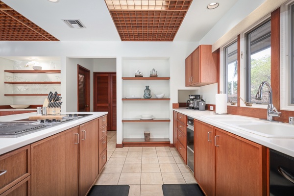 Ample counter space with a center island cooktop and prep area