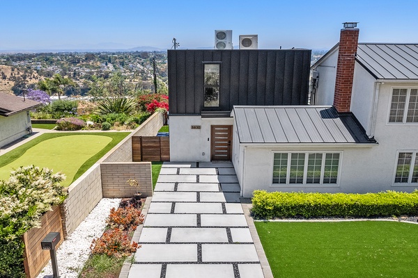 Private entry and yard with one wall connected to main house.