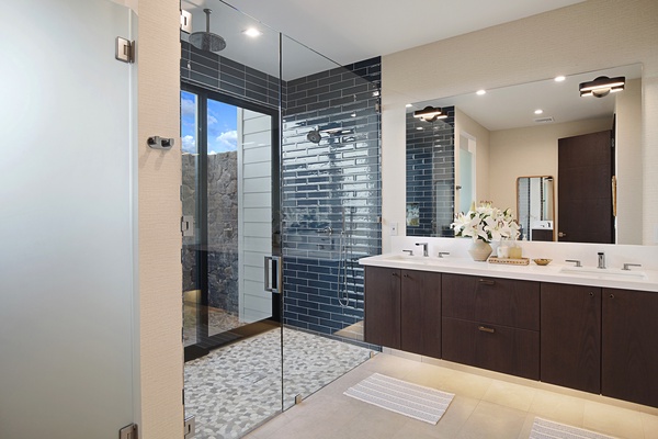 Ensuite bathroom with a shower in a glass enclosure.