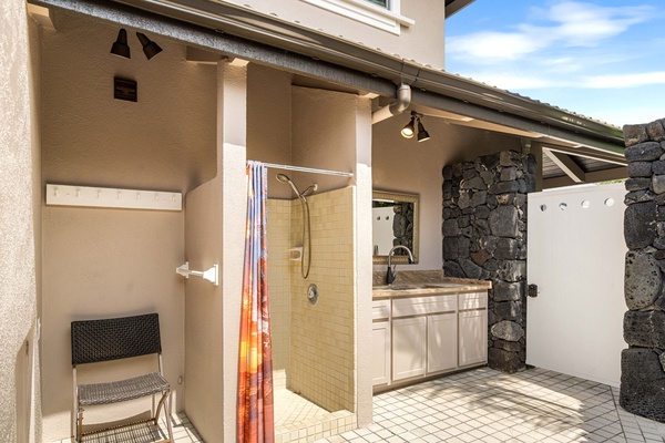 Outdoor shower and laundry sink area