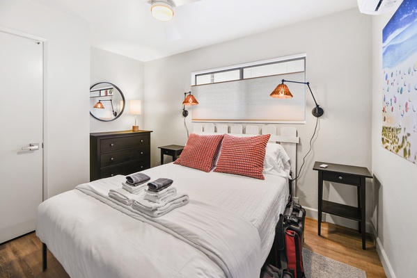 The second guest suite with bedside reading lights.