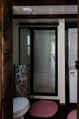 A compact bathroom thoughtfully designed to offer all essential comforts in a small footprint.