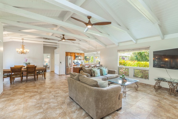 Mala Hale has an open concept layout with vaulted ceilings, ceiling fans and a living area that flows into the dining room