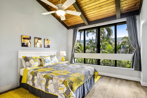 Guest bedroom offering A/C, mountain views, Queen bed, vaulted ceilings and a rejuvenating color scheme