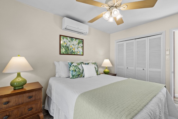 Enjoy a serene night in the second guest suite, featuring a modern cooling.