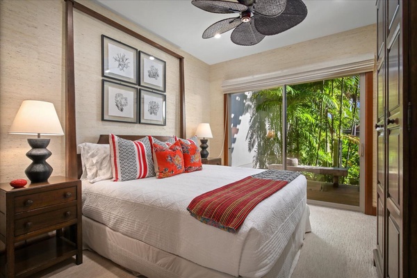 The third bedroom, also on the upper level, features a queen bed, shared bathroom, and its own private lanai.