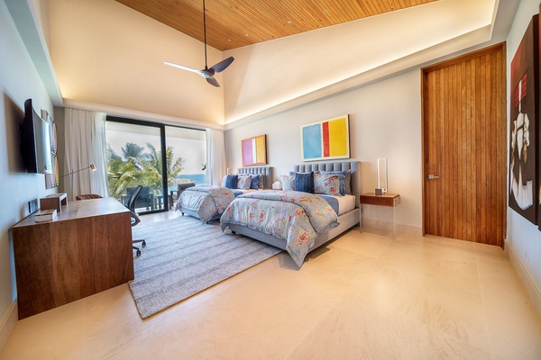 Guest bedroom with two queen beds, with beautiful views from the private balcony.