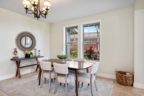 Cozy dining area with natural light and a view of lush greenery.