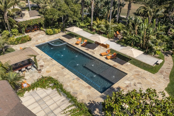 Chaise loungers poolside to relax.