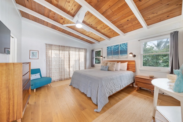 The primary bedroom with California king and a fold-out chair that coverts into a sleeping space for 1 child