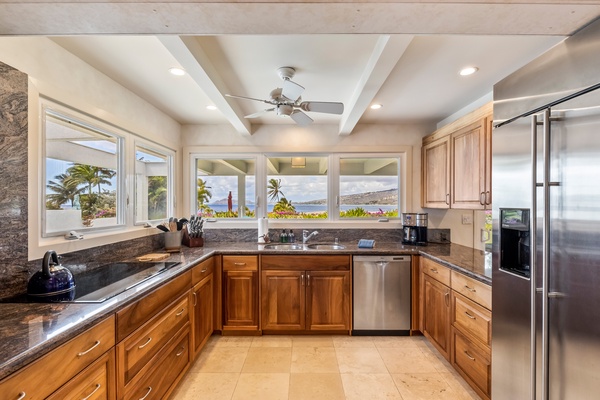 The kitchen is a chef's dream, recently refurbished with gorgeous Koa wood cabinets, granite countertops, stainless steel appliances