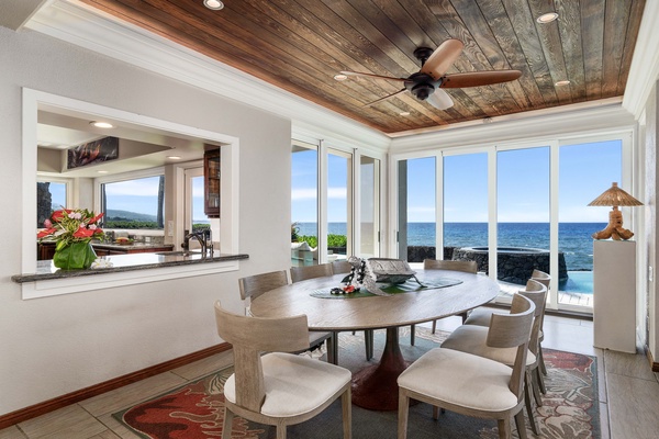 Indoor dining with views over the infinity edge into the ocean!