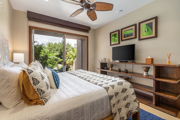 Downstairs guest room with king bed, flat screen TV, deck and adjacent bath.