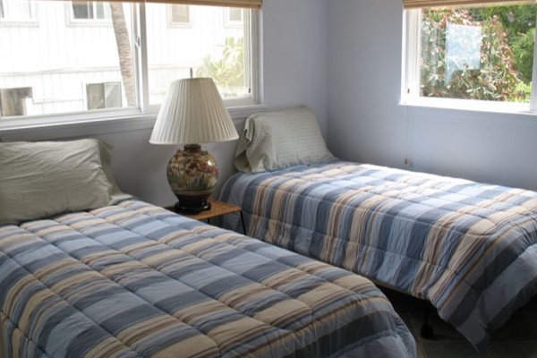 Guest bedroom with two twin single beds.