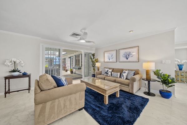 Inviting living area bathed in natural light, offering a cozy retreat for relaxation and leisure.