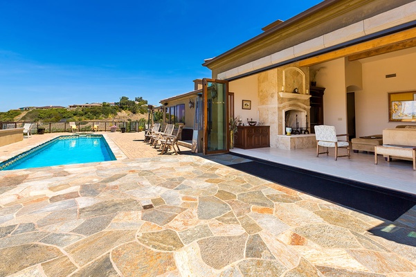 Living area opens completely to the pool and patio areas