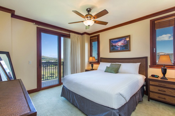 Primary bedroom with TV & private lanai, golf course view, walk-in closet, dual sinks, and a separate tub and shower.