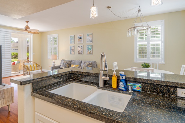 Kitchen with modern amenities and a spacious countertop for easy meal prep and gatherings.