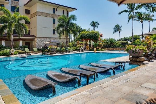 Ko Olina beach villas lap pool and lounge chairs outside our vacation villa in Oahu.